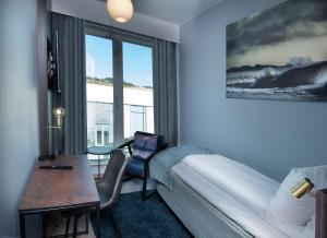 Ένα ή περισσότερα κρεβάτια σε δωμάτιο στο Mandal Hotel