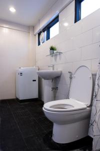 a bathroom with a white toilet and a sink at T2 2 Bedrooms 6 guests Full kitchen 1 min to BTS in Bangkok +28 photos