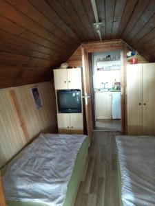 Posteľ alebo postele v izbe v ubytovaní Karos Centrál Apartmanház