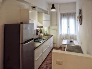 A kitchen or kitchenette at New Capolinea 5 - Apartment