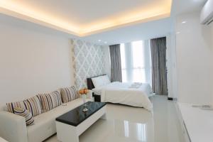 Postel nebo postele na pokoji v ubytování CA&SA Serviced Apartment