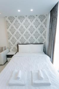 Postel nebo postele na pokoji v ubytování CA&SA Serviced Apartment