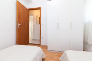 Posteľ alebo postele v izbe v ubytovaní Kuća Ella