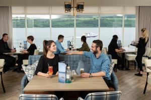 people sitting at a table in a restaurant at Loch Ness Clansman Hotel in Drumnadrochit