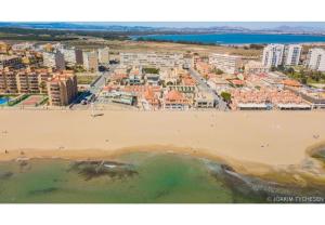 an aerial view of a beach with buildings at 38 Fantastic Holiday // AC - WIFI in La Mata
