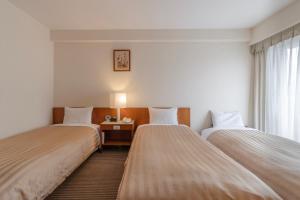 Postel nebo postele na pokoji v ubytování Hotel Gimmond Kyoto + 29 fotografií