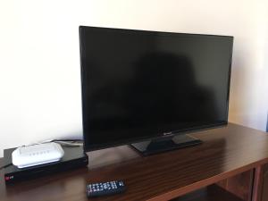 TV a/nebo společenská místnost v ubytování Casa de Teones