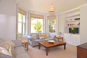 a living room with a couch and a coffee table at Littledale Haven in Eastbourne