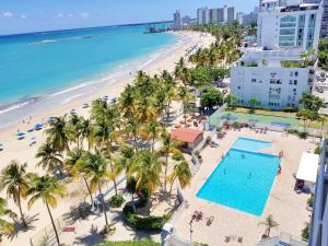 an aerial view of the beach and the ocean at Marbella del Caribe Isla Verde Beachfront in San Juan