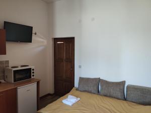 a living room with a couch and a microwave at Luna in Prokuplje +21 photos