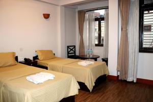 Ένα ή περισσότερα κρεβάτια σε δωμάτιο στο Hotel Yala Peak