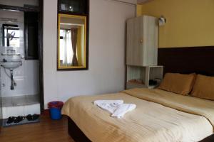 Ένα ή περισσότερα κρεβάτια σε δωμάτιο στο Hotel Yala Peak