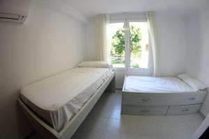 Postel nebo postele na pokoji v ubytování Playa Bella 2-2A + 12 fotografií