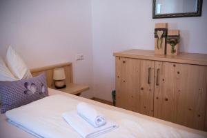 A bed or beds in a room at Appartements Spitaler