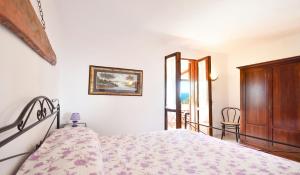 Postel nebo postele na pokoji v ubytování Amore Rentals - Villa Bacco