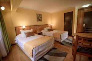 Postel nebo postele na pokoji v ubytování Hotel del Valle Azapa