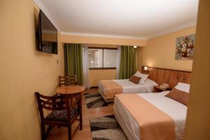 Postel nebo postele na pokoji v ubytování Hotel del Valle Azapa