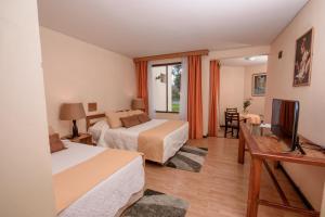 TV a/nebo společenská místnost v ubytování Hotel del Valle Azapa