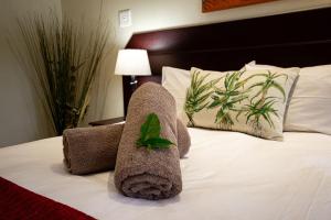Ένα ή περισσότερα κρεβάτια σε δωμάτιο στο Forest Lodge