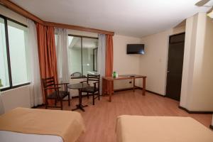 TV a/nebo společenská místnost v ubytování Hotel del Valle Azapa