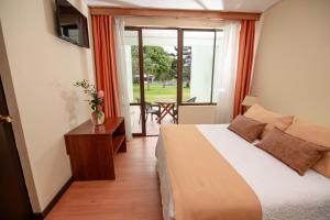 Postel nebo postele na pokoji v ubytování Hotel del Valle Azapa