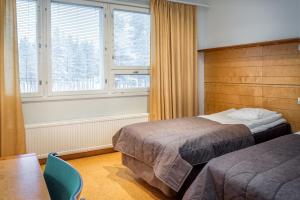 Postel nebo postele na pokoji v ubytování Rokua Health & Spa