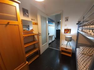 a room with two bunk beds and a hallway at Centrale & Parking in Genoa