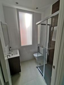 a bathroom with a shower and a sink and a toilet at Begoña 18 Rest & Adventure in Gijón