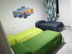 Łóżko lub łóżka w pokoju w obiekcie Casa Mia