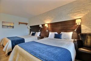 Postel nebo postele na pokoji v ubytování Hotel Motel Le Quiet