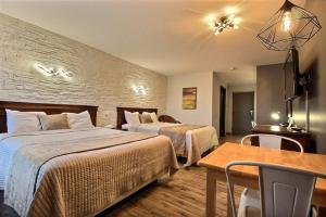 Postel nebo postele na pokoji v ubytování Hotel Motel Le Quiet