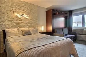 Postel nebo postele na pokoji v ubytování Hotel Motel Le Quiet