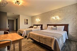 Postel nebo postele na pokoji v ubytování Hotel Motel Le Quiet