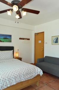 a bedroom with a bed and a lamp at Bali Holiday Resort in Hong Kong