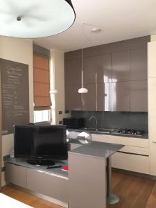 Kuchyň nebo kuchyňský kout v ubytování Corso Como - New Building Apartment