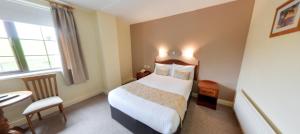 Ліжко або ліжка в номері Hotel Curracloe