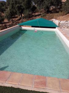 Het zwembad bij of vlak bij Alojamiento Los Chozos