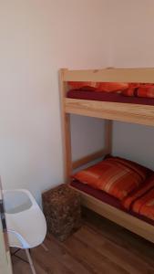 A bed or beds in a room at Chata Lesní