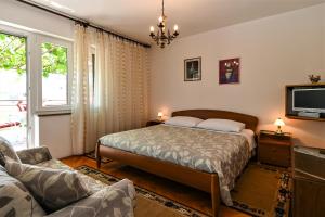 Postel nebo postele na pokoji v ubytování Apartment Lara + 26 fotografií