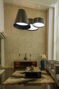 a kitchen with a lamp, a sink, and a counter top at Lindóya Hotel in Catalão