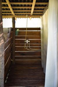 a wooden walkway with a hose in a building at Alföldi Jurta Ruzsa in Ruzsa