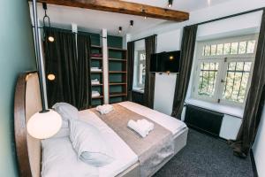 Postel nebo postele na pokoji v ubytování Atoneli Apartment hotel
