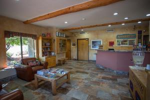 a living room with a couch and a table at Southwest Inn at Sedona in Sedona