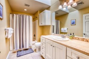 a bathroom with a sink and a toilet and a shower at Modern Upscale Seaside Beach House in Seaside +26 photos