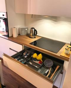 a kitchen with a stove top oven in a kitchen at The Suite in Santa Maria Navarrese