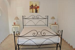 A bed or beds in a room at Residence Le Zagare