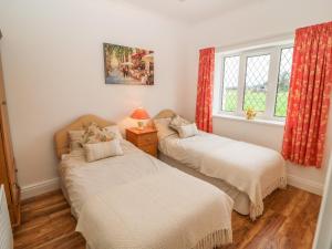 A bed or beds in a room at Dirreen House