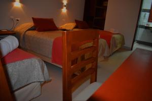Een bed of bedden in een kamer bij Hotel Boutique Vendimia
