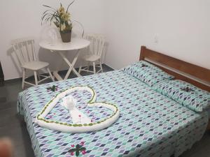 Cama o camas de una habitación en Vargas Peruibe Hotel