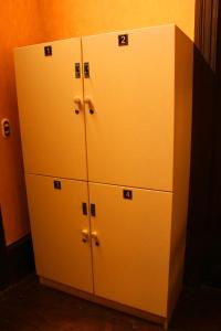 a group of white lockers in a room at KACLLA, The Healing Dog Hostel in Lima